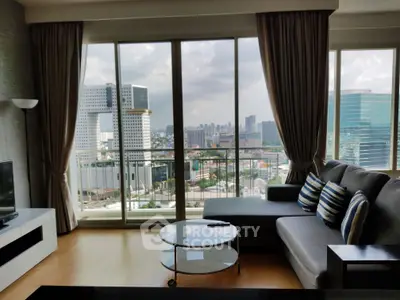 Spacious living room with panoramic city view and modern furnishings