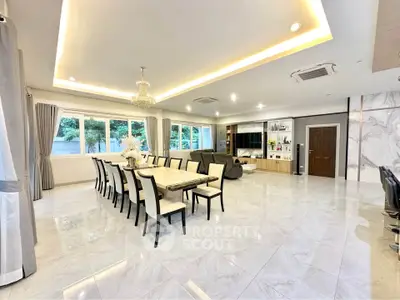 Spacious modern living room with elegant dining area and large windows