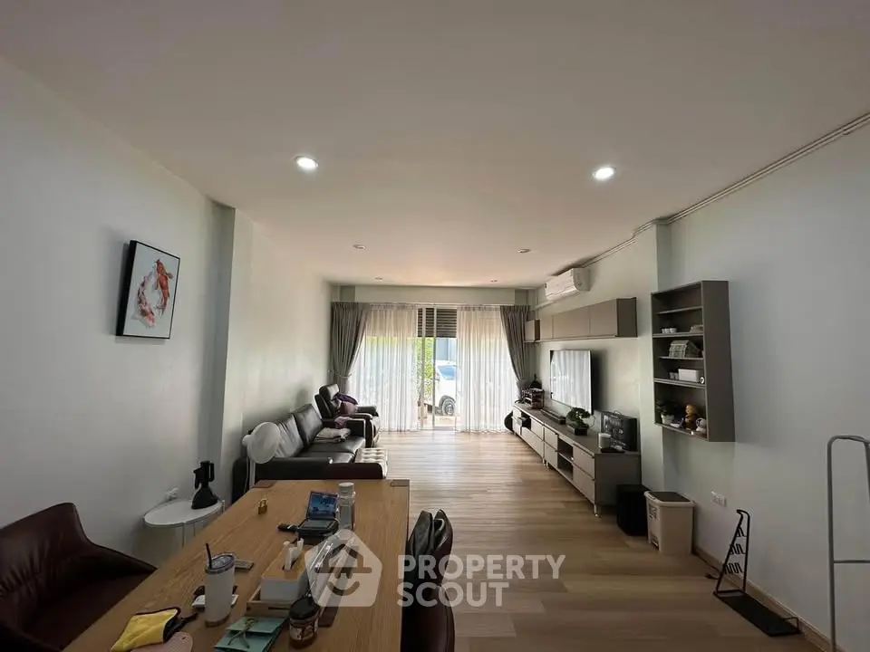 Spacious modern living room with elegant decor and natural light