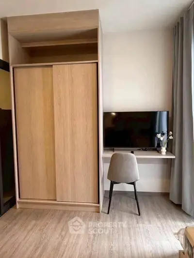 Modern bedroom with sleek wardrobe and stylish desk setup