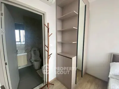 Modern apartment with sleek bathroom and built-in storage