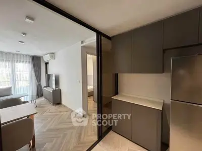 Modern apartment interior with open layout and sleek kitchen design