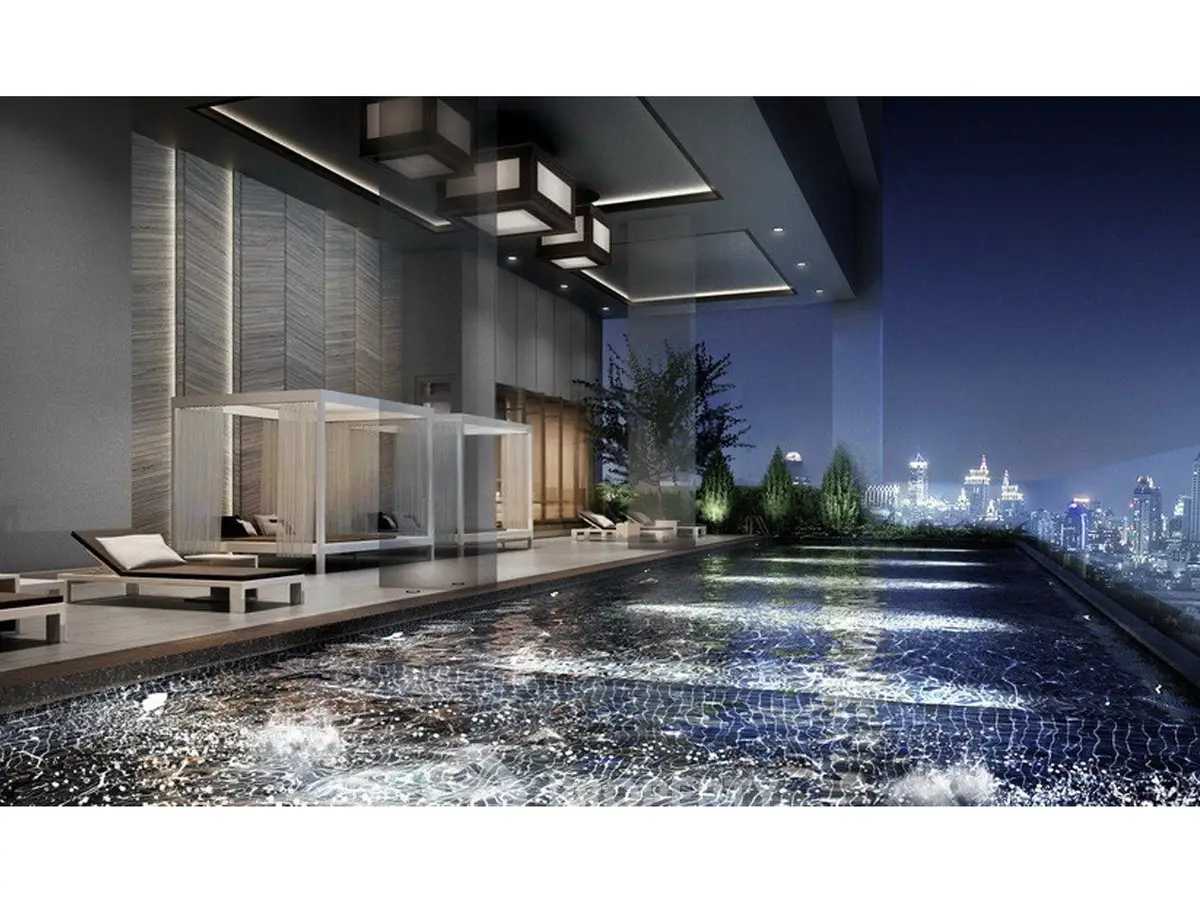 Luxurious rooftop pool with stunning city skyline view at night