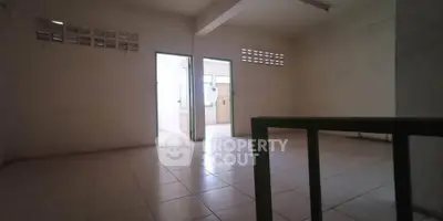 Spacious unfurnished room with tiled flooring and natural light