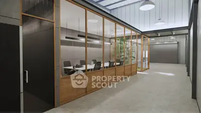 Modern industrial office space with glass walls and sleek design