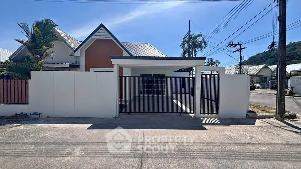 Charming single-story home with gated entrance and modern design in a serene neighborhood.