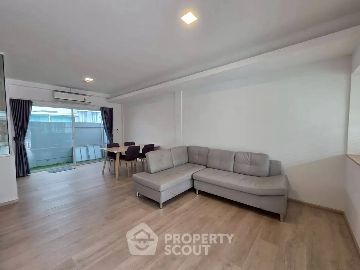 Spacious modern living room with sleek furniture and natural light