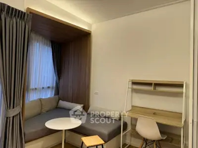 Modern study nook with cozy seating and desk in stylish apartment