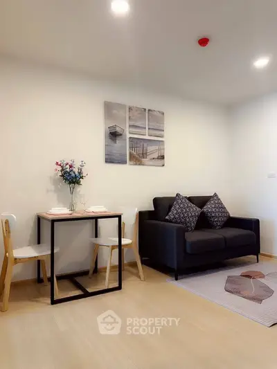 Modern living room with cozy sofa and dining area in stylish apartment