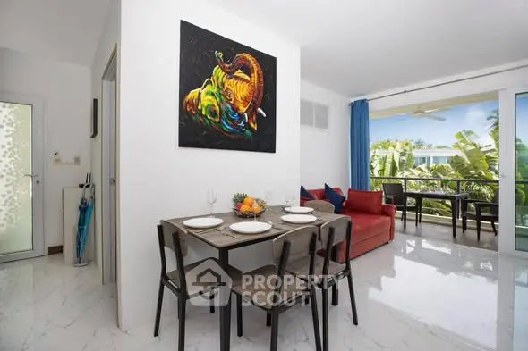 Modern living room with dining area and balcony view in a stylish apartment.