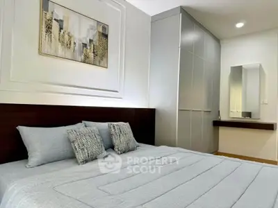 Modern bedroom with stylish decor and built-in wardrobe