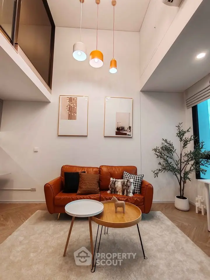 Modern living room with high ceiling and stylish decor