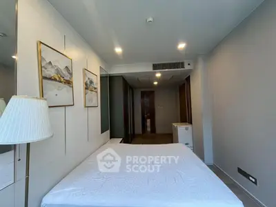 Modern bedroom with stylish decor and ample natural light