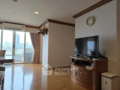 Spacious living room with city view and elegant wooden furniture
