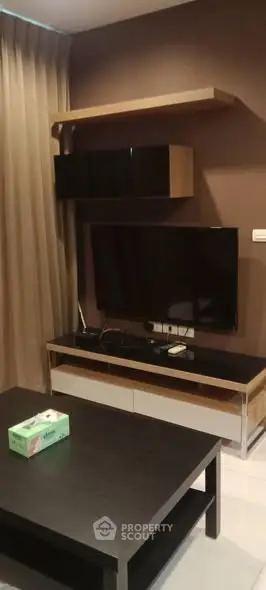 Modern living room with sleek TV setup and stylish furniture