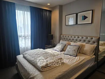 Luxurious bedroom with elegant decor and plush bedding in modern apartment