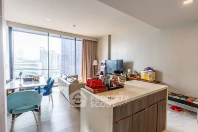 Modern open-plan living room with city view and stylish furniture