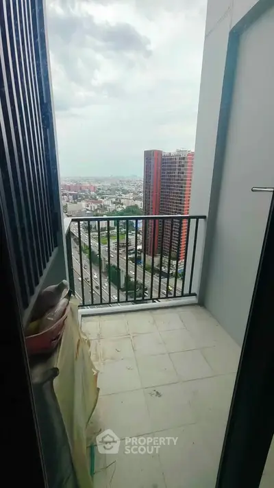 High-rise balcony with stunning cityscape view, perfect for urban living.