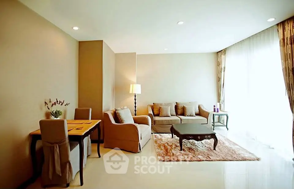 Spacious living room with elegant decor and natural light