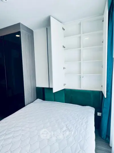 Modern bedroom with built-in storage and stylish decor