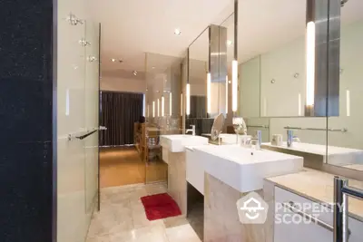 Luxurious modern bathroom with dual sinks and elegant lighting