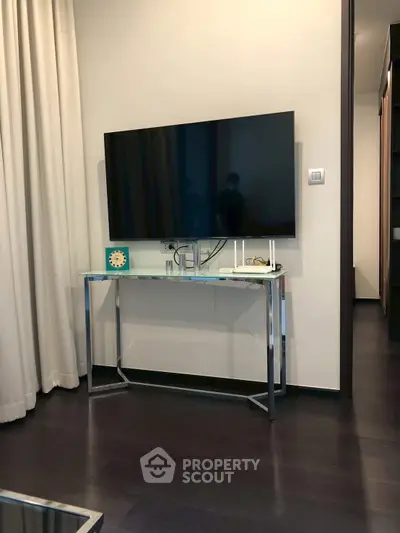 Modern living room with sleek TV setup and elegant decor