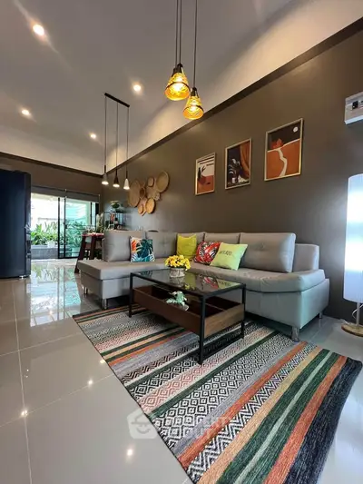 Stylish modern living room with elegant decor and spacious seating area, perfect for relaxation and entertainment.