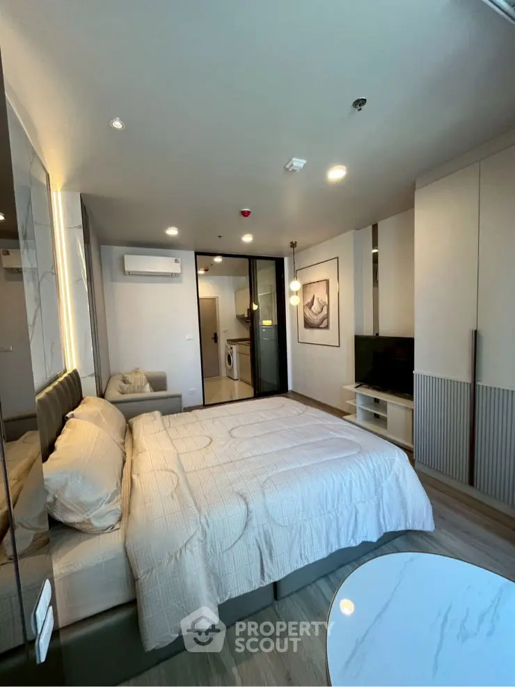 Cozy bedroom with modern decor and comfortable bedding