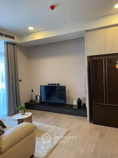 Modern living room with sleek TV setup and cozy decor
