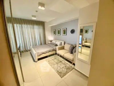 Modern bedroom with stylish decor and natural light in a contemporary apartment.