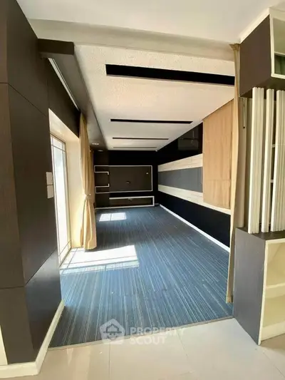 Spacious modern living room with large windows and stylish decor