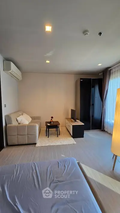 Modern living room with cozy sofa and stylish decor