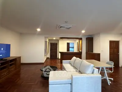Spacious living room with modern furniture and open layout, perfect for family gatherings.