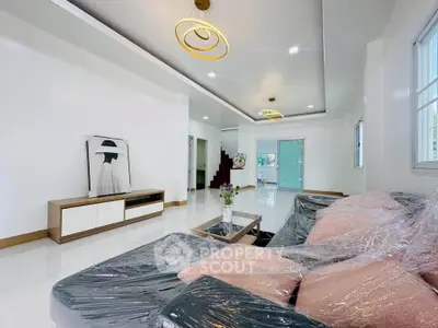 Spacious modern living room with stylish decor and ample natural light