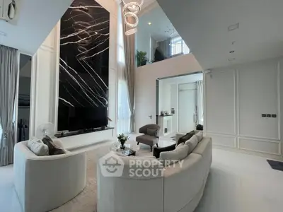 Luxurious modern living room with high ceilings and elegant decor