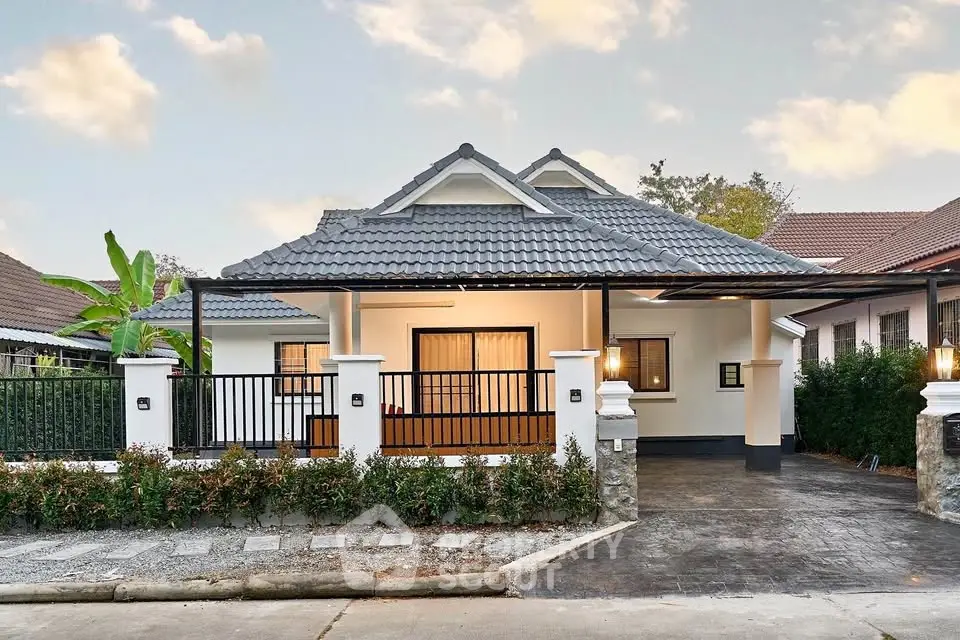 Charming single-story house with modern design and spacious driveway in a serene neighborhood.