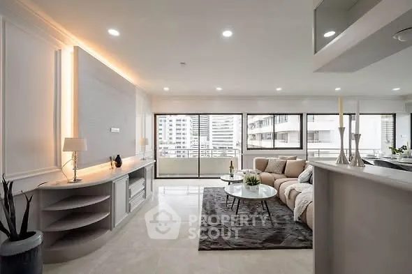 Spacious modern living room with elegant decor and city view