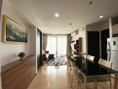 Modern open-plan living room with dining area and natural light