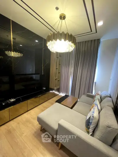 Luxurious living room with elegant chandelier and modern decor