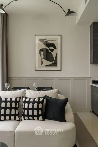 Modern living room with stylish decor and abstract art on the wall