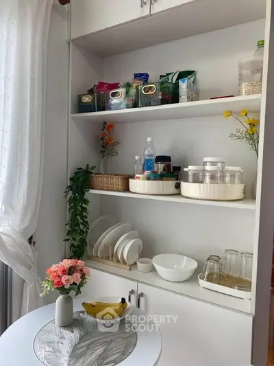 Charming kitchen nook with open shelving and elegant table setting