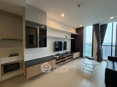 Modern living room with sleek entertainment center and city view