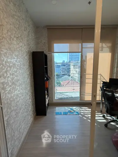 Modern living room with large windows and city view