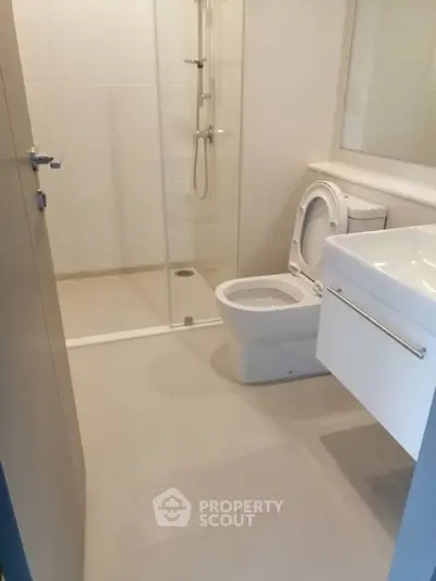 Modern bathroom with glass shower and sleek fixtures