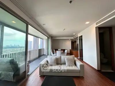Spacious living room with stunning city view and large balcony in modern apartment