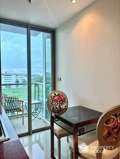 Modern dining area with balcony view in luxury apartment