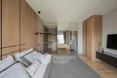 Modern bedroom with elegant wooden paneling and stylish decor