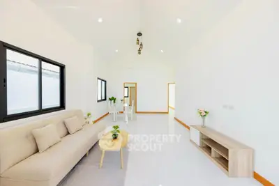 Spacious modern living room with minimalist decor and natural light