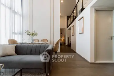 Modern living room with elegant dining area and stylish decor