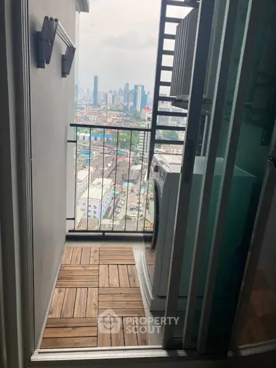 Charming balcony with city view and washing machine, perfect for urban living.